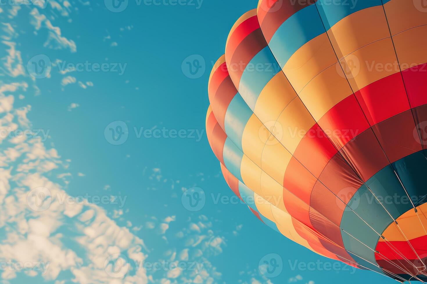 Colorful hot air balloon floating in the blue sky photo