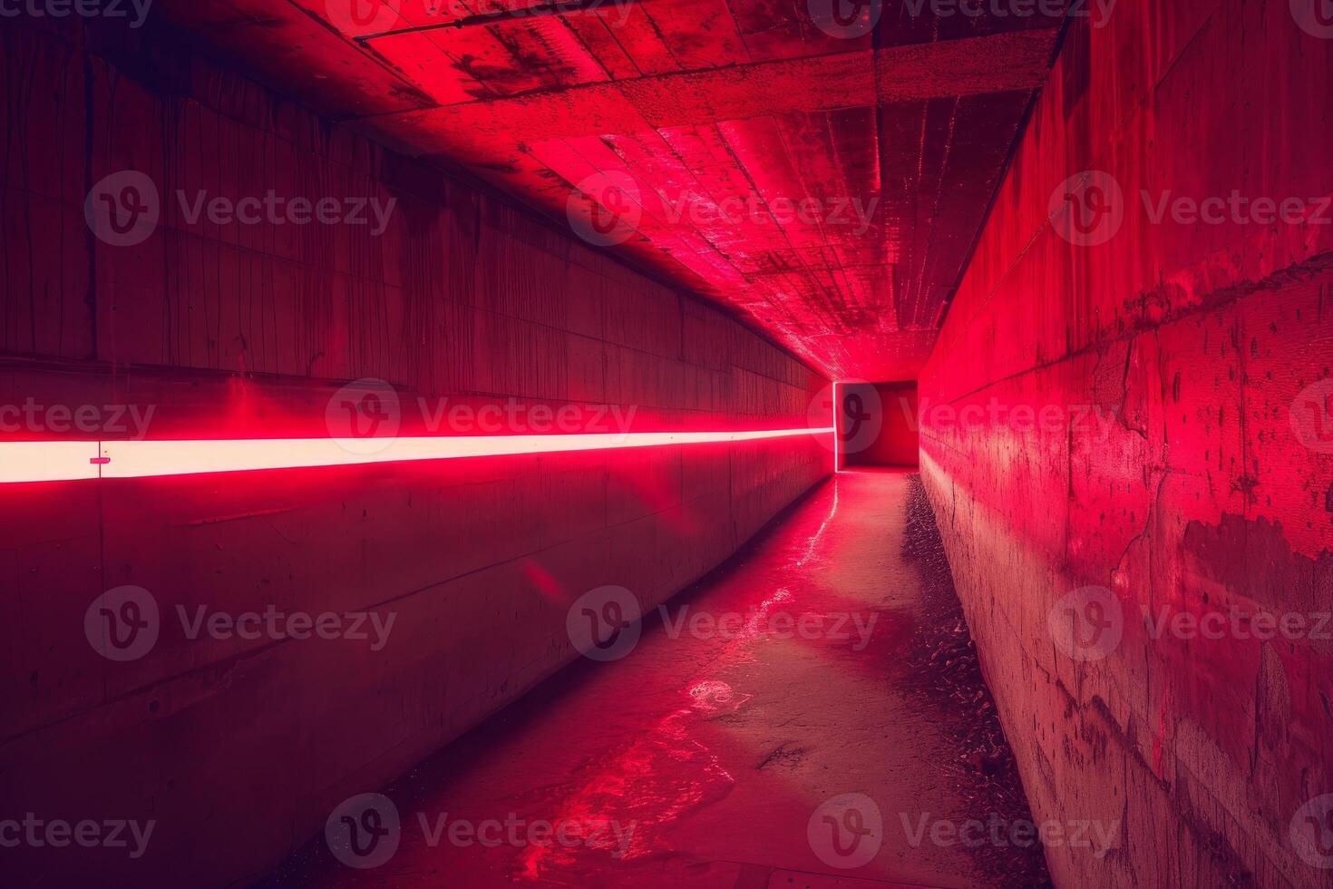 Red neon light illuminating a dark gritty urban tunnel photo