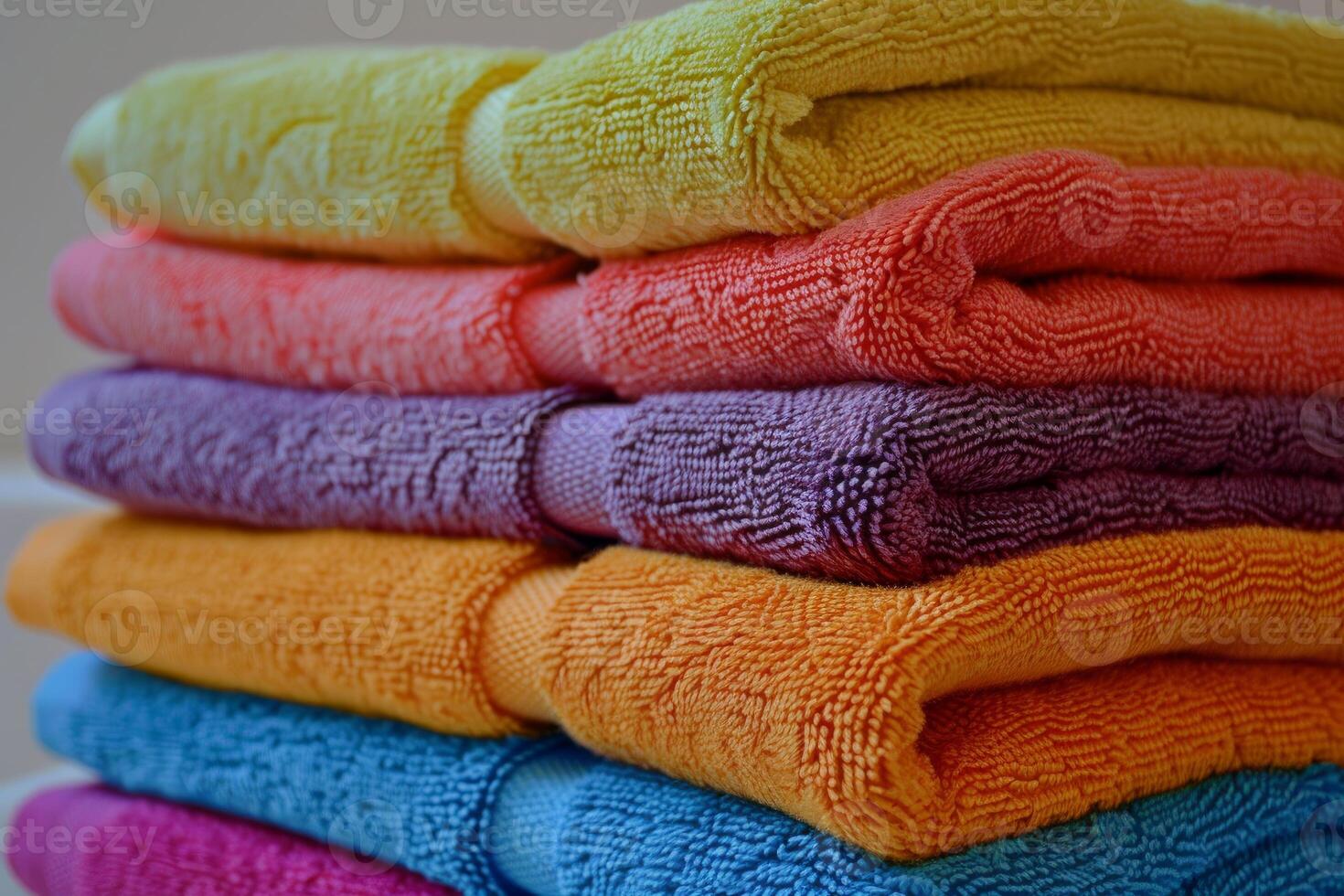 Stack of colorful towels folded and lying on top of each other photo