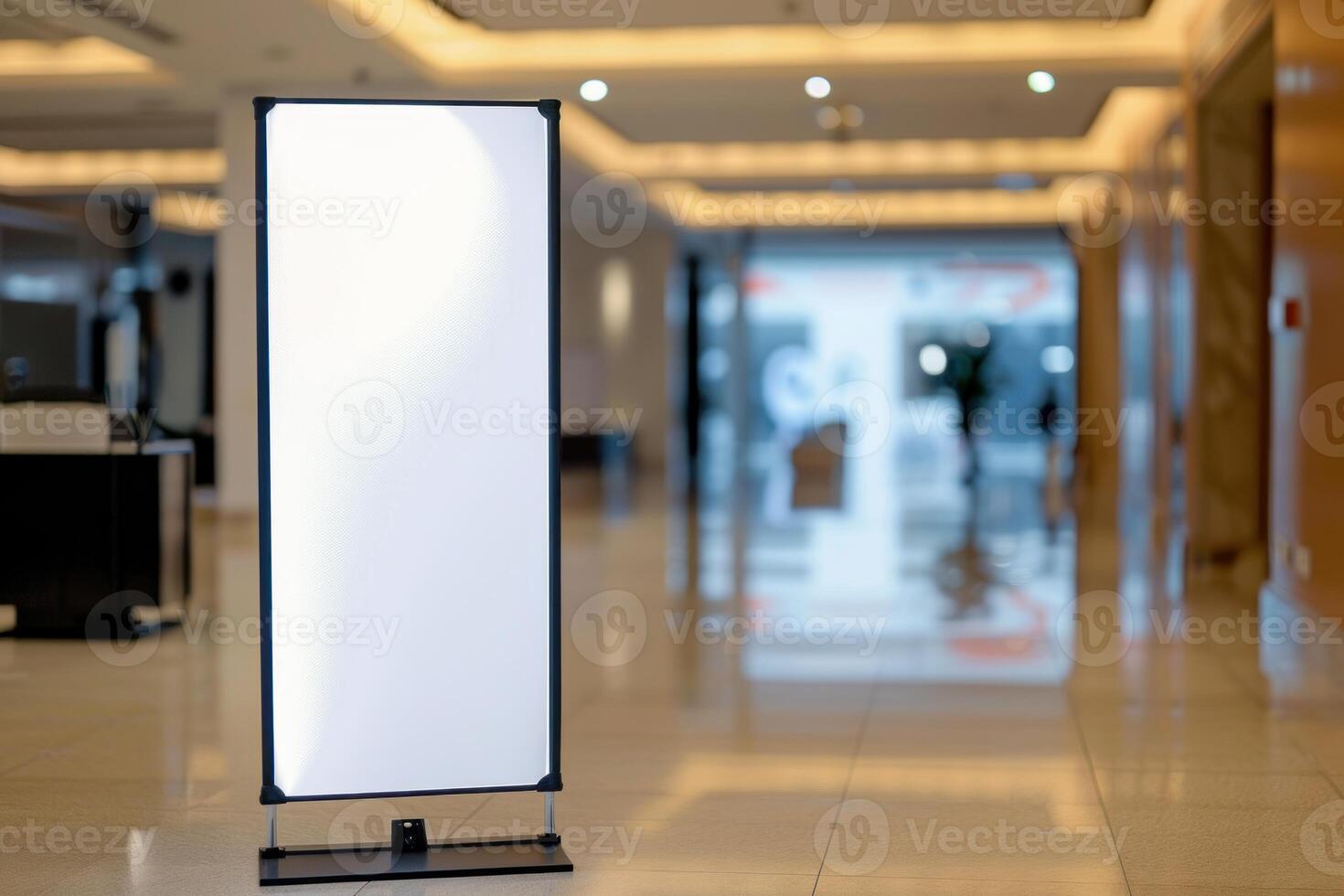 Blank advertising banner standing in busy hotel lobby photo