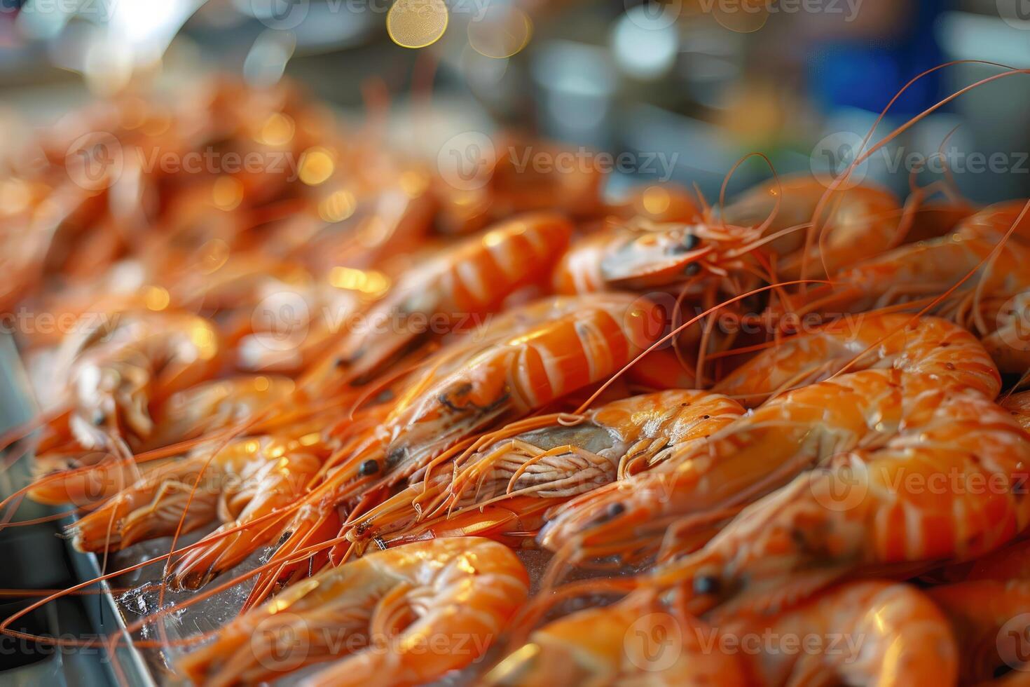 Freshly cooked tiger prawns resting on ice at a seafood restaurant buffet photo