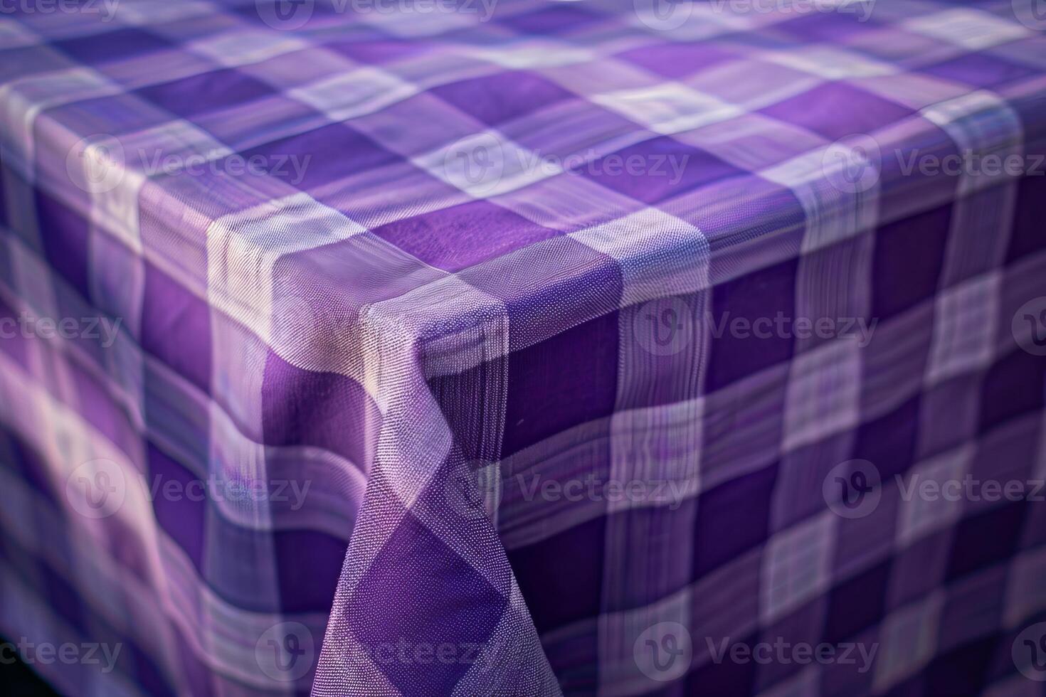 Purple tablecloth with square pattern covering a table photo