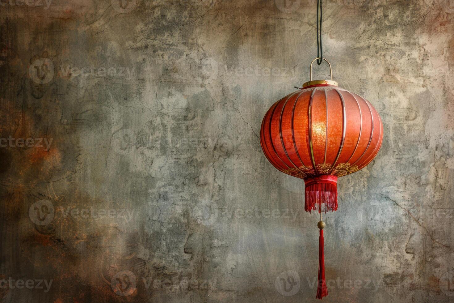 Traditional chinese paper lantern hanging on old textured wall background photo