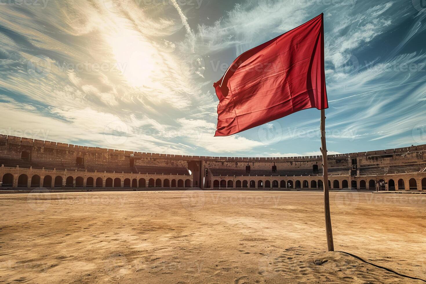 Red flag waving in a sunny ancient roman arena photo