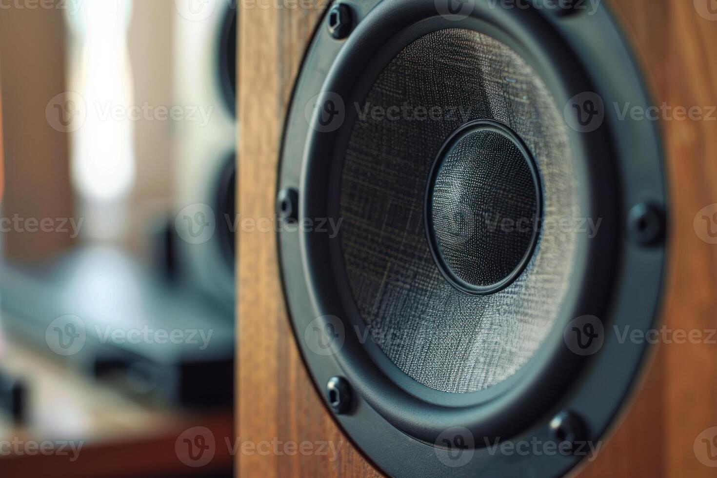 Powerful audio speaker vibrating creating sound waves in a music studio photo