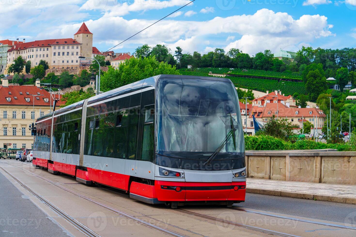 This sleek, modern red tram is essential to the citys public transportation. Its favored by locals and tourists for a comfortable, convenient way to explore the sights and attractions. photo