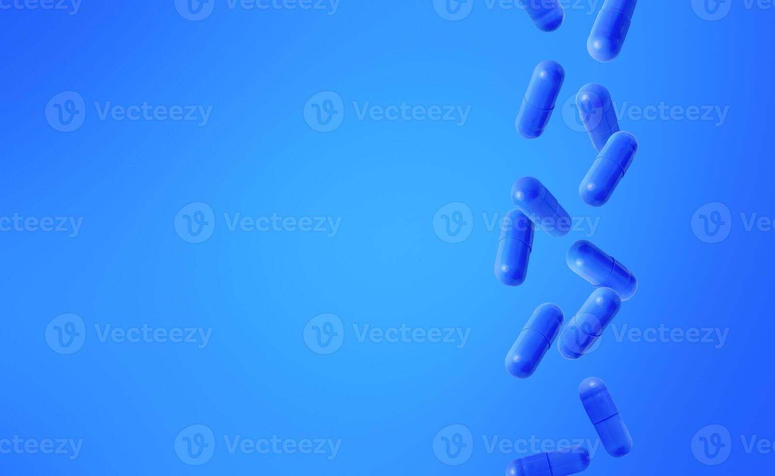 Blue capsules falling against a gradient blue background. Medical background with copy space. Stock photo