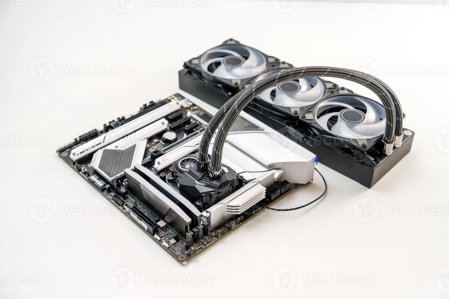An isolated view of a stylish white themed gaming motherboard equipped with a CPU liquid cooling system. It features a sleek black and white color scheme with vivid RGB lighting accents. photo