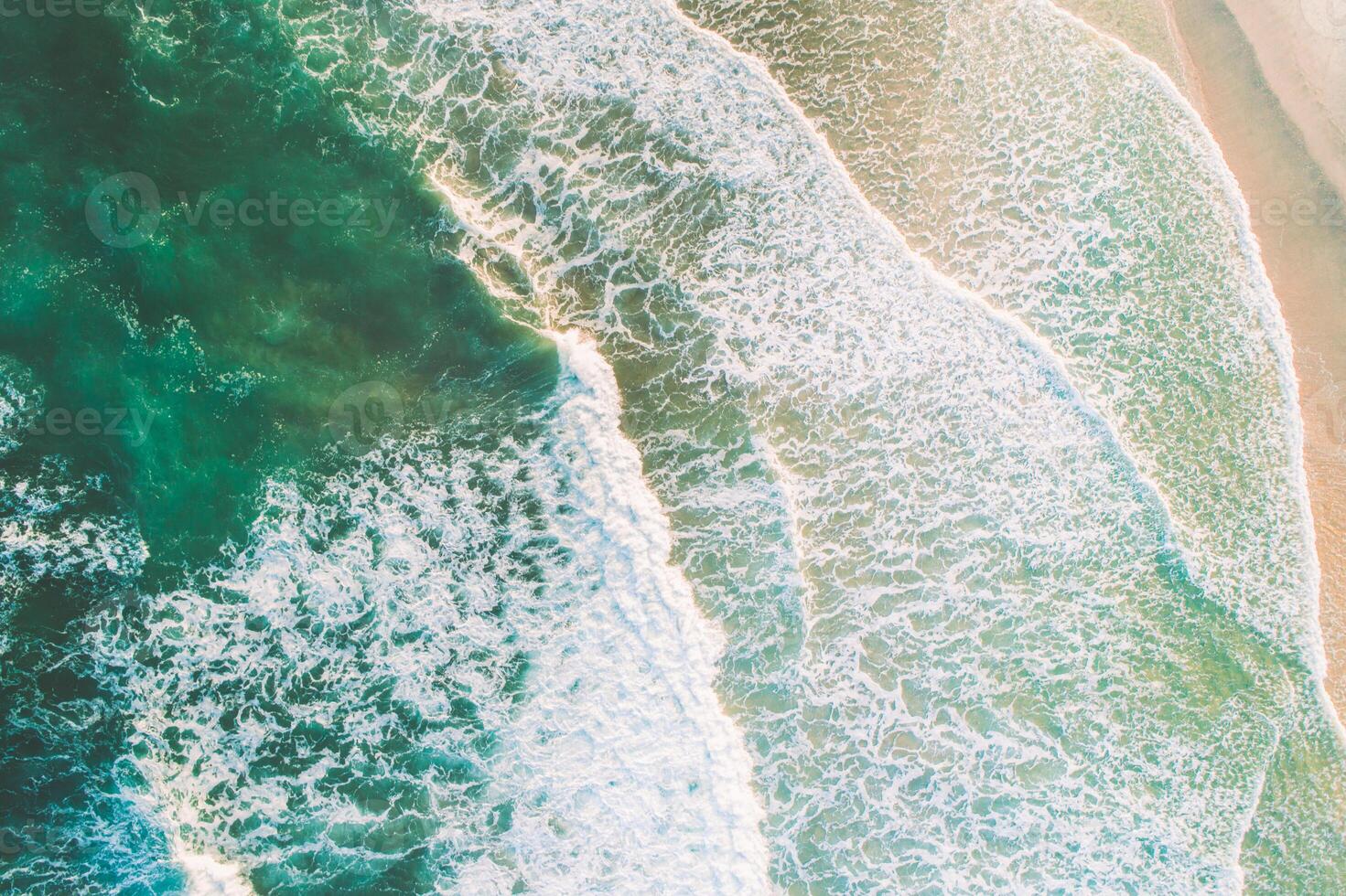 An aerial view of the ocean and waves photo