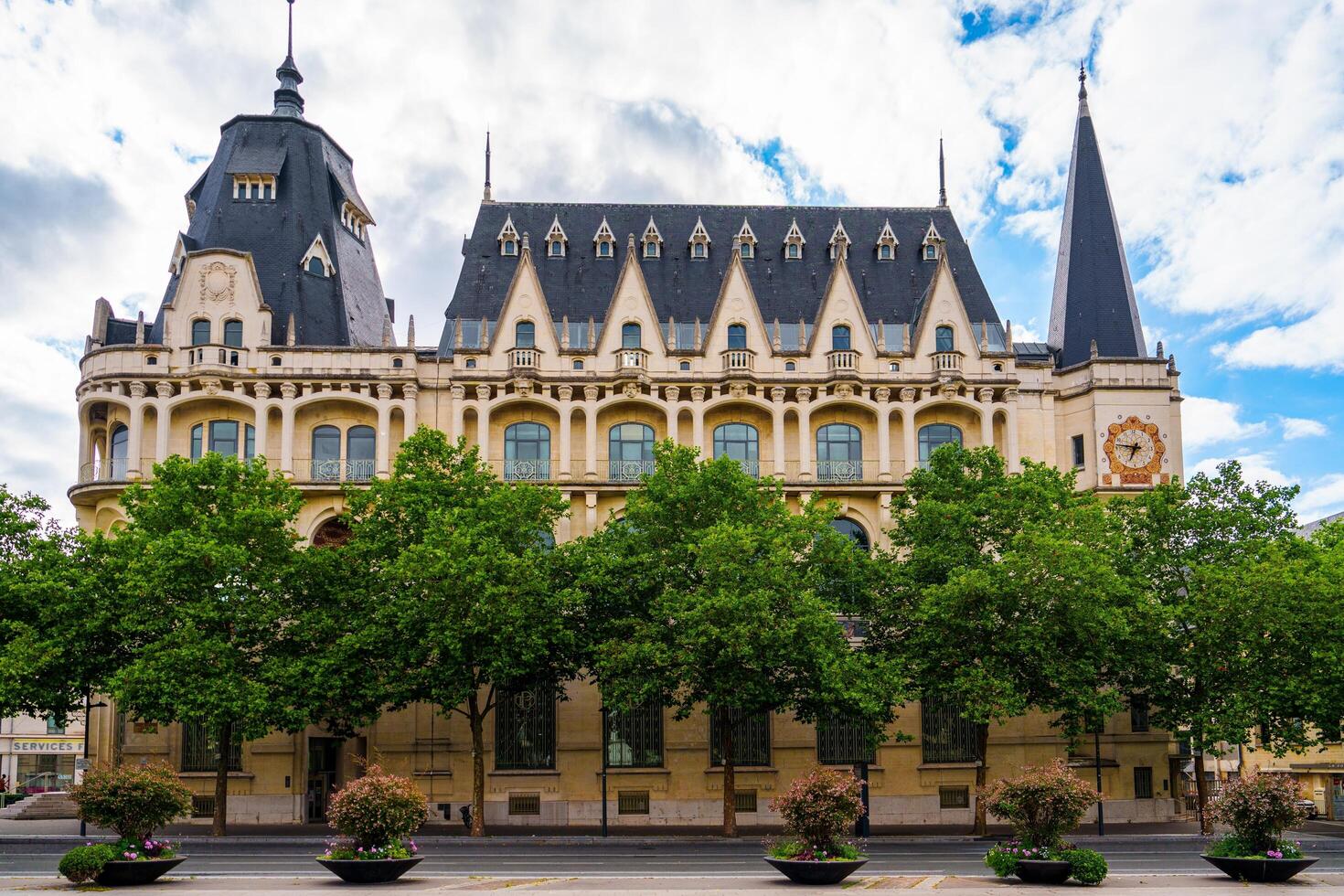 Chartres, France. This historic building features a mansard roof and ornate details, showcasing beautiful French architecture. It attracts many tourists and offers insights into the citys rich history. photo