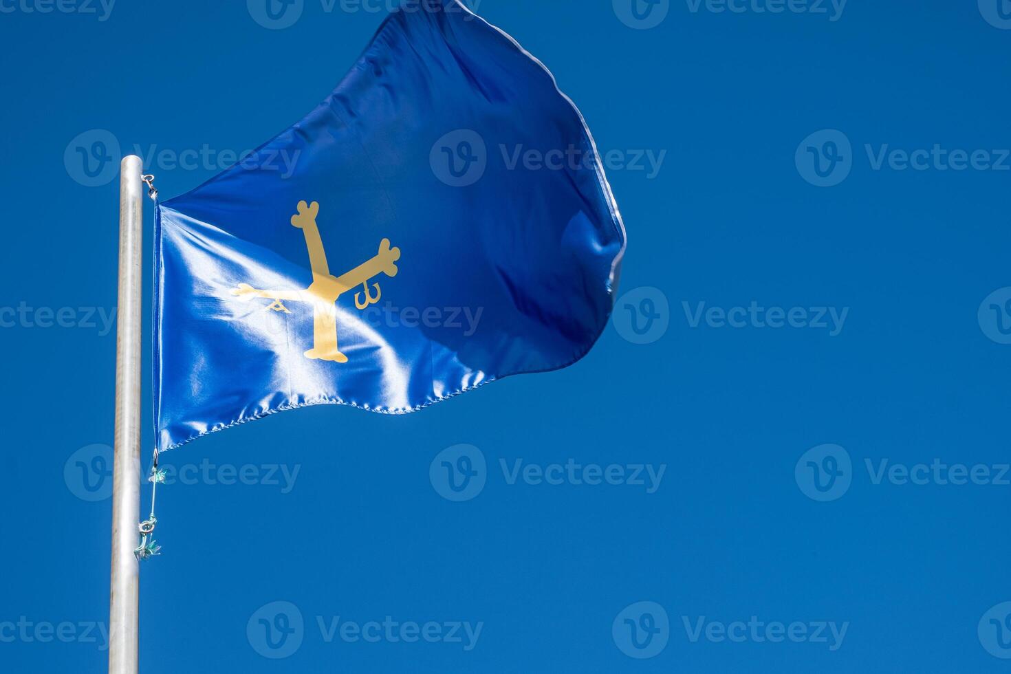 A blue flag with a yellow star on it photo