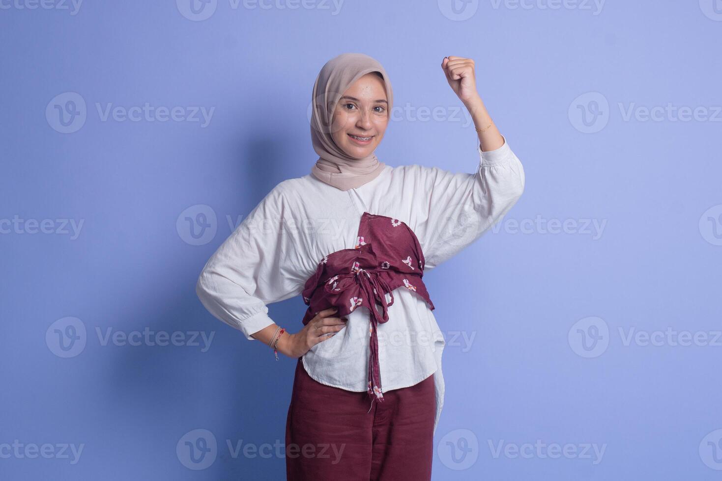 Young muslim woman with a belt on her back photo