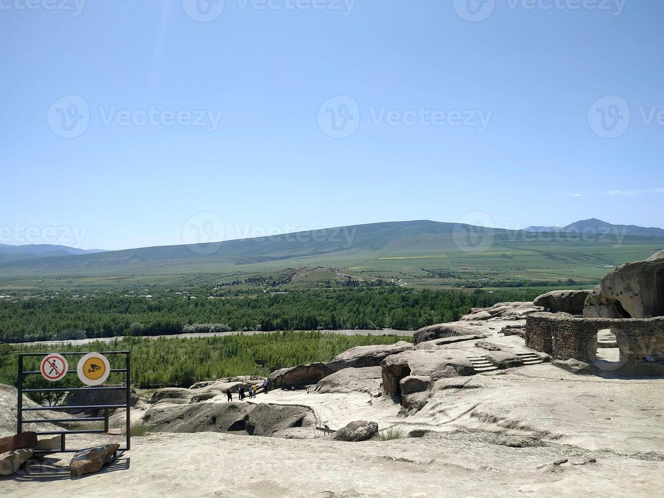 Breathtaking view from ancient ruins overlooking lush valleys and distant mountains during a bright sunny day in Mongolia photo