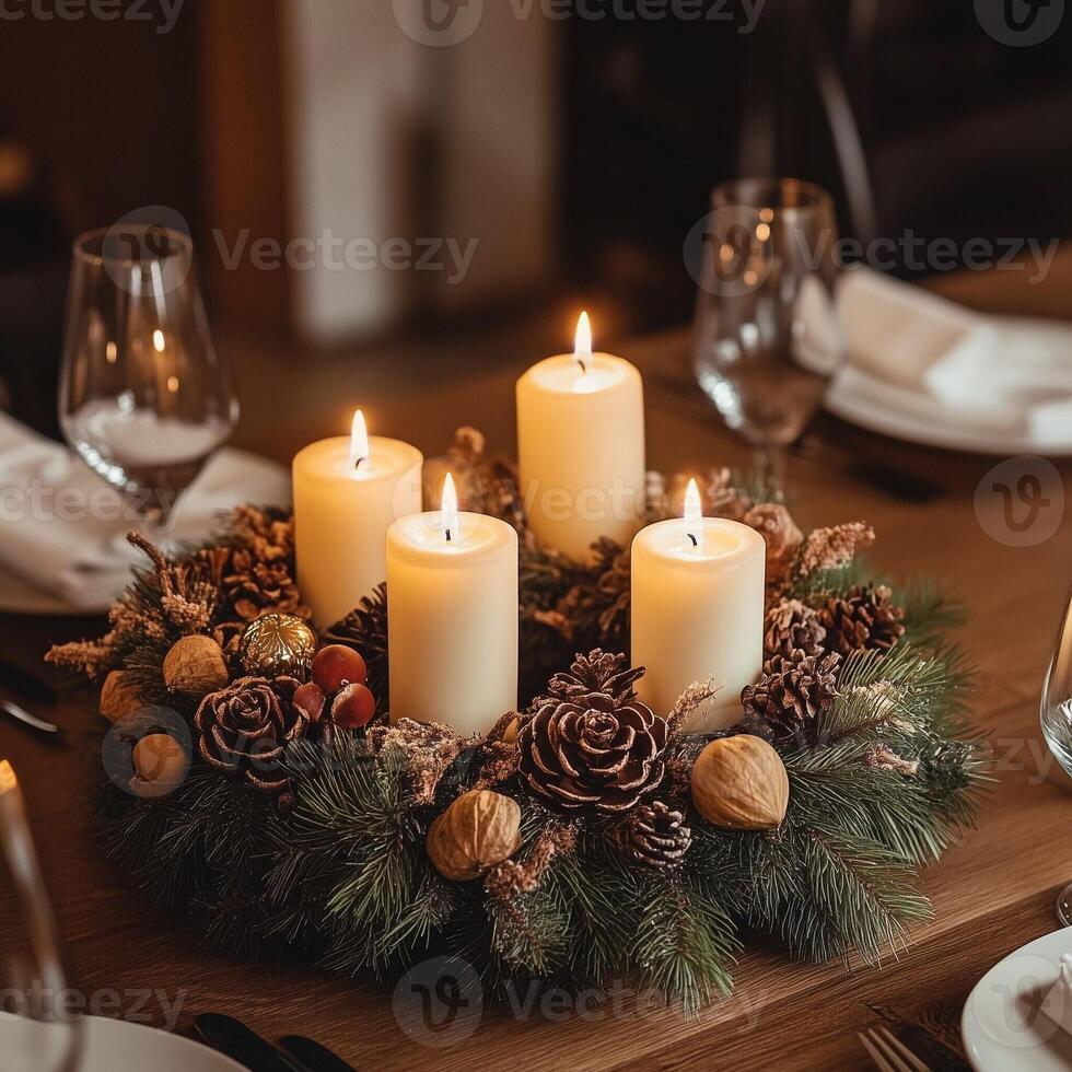 Elegant Christmas table centerpiece with glowing candles, pine cones, poinsettias, and festive ornaments, creating a cozy holiday atmosphere photo