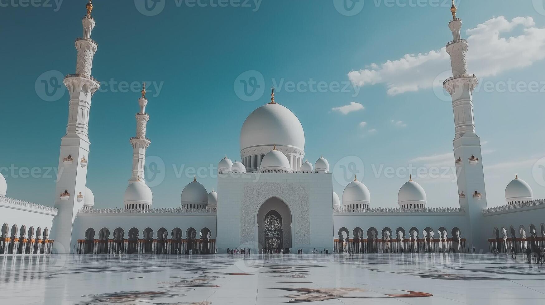 Beautiful white mosque with large domes and tall minarets under a bright blue sky, reflecting Islamic architecture photo