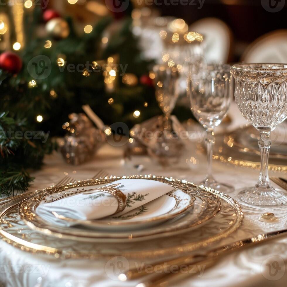 Luxurious Christmas dinner table setting with elegant plates, crystal glasses, and festive decorations photo