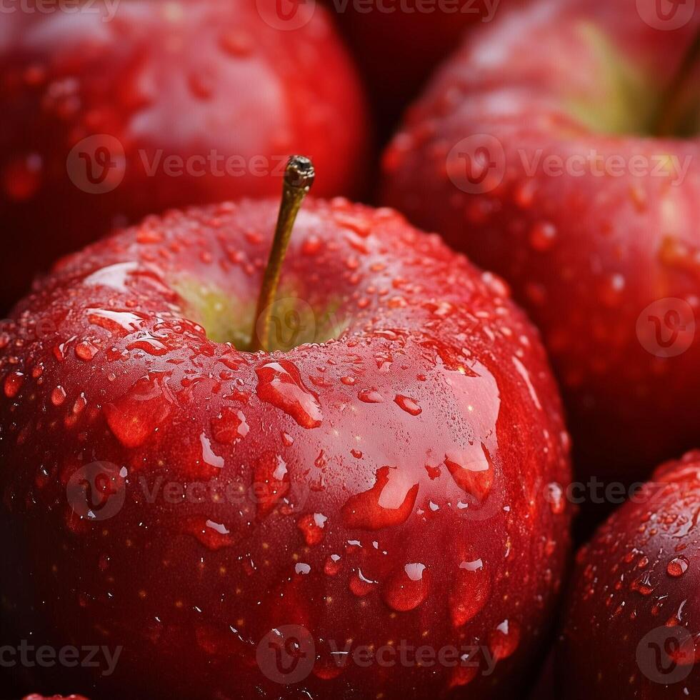 Fresh red apple covered in water droplets in a close-up view showcasing its vibrant color and natural texture photo