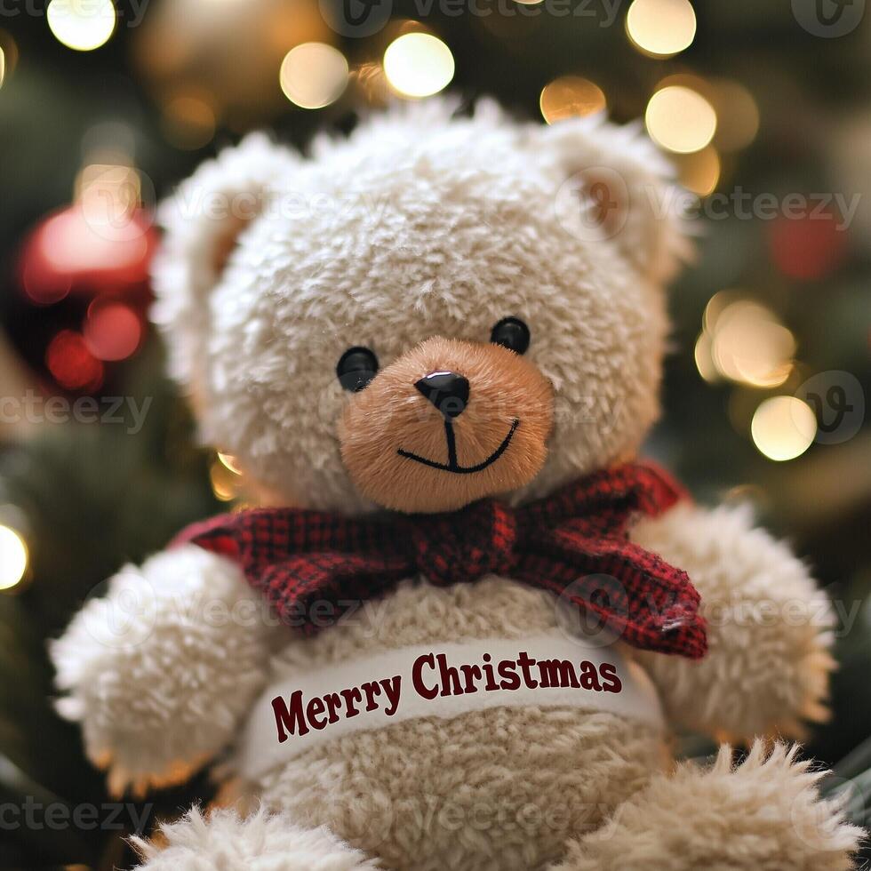 Fluffy white teddy bear with a red scarf and Merry Christmas message sitting in front of festive holiday lights photo