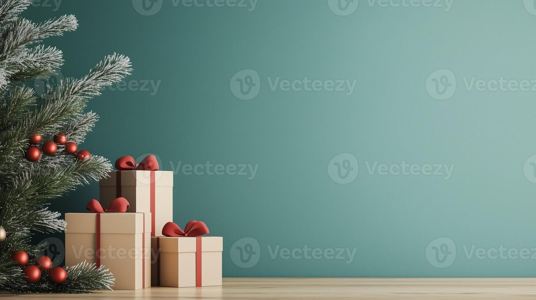 Christmas gift boxes with copy space for text, red bows and ornaments next to a snow dusted pine tree on a teal background photo