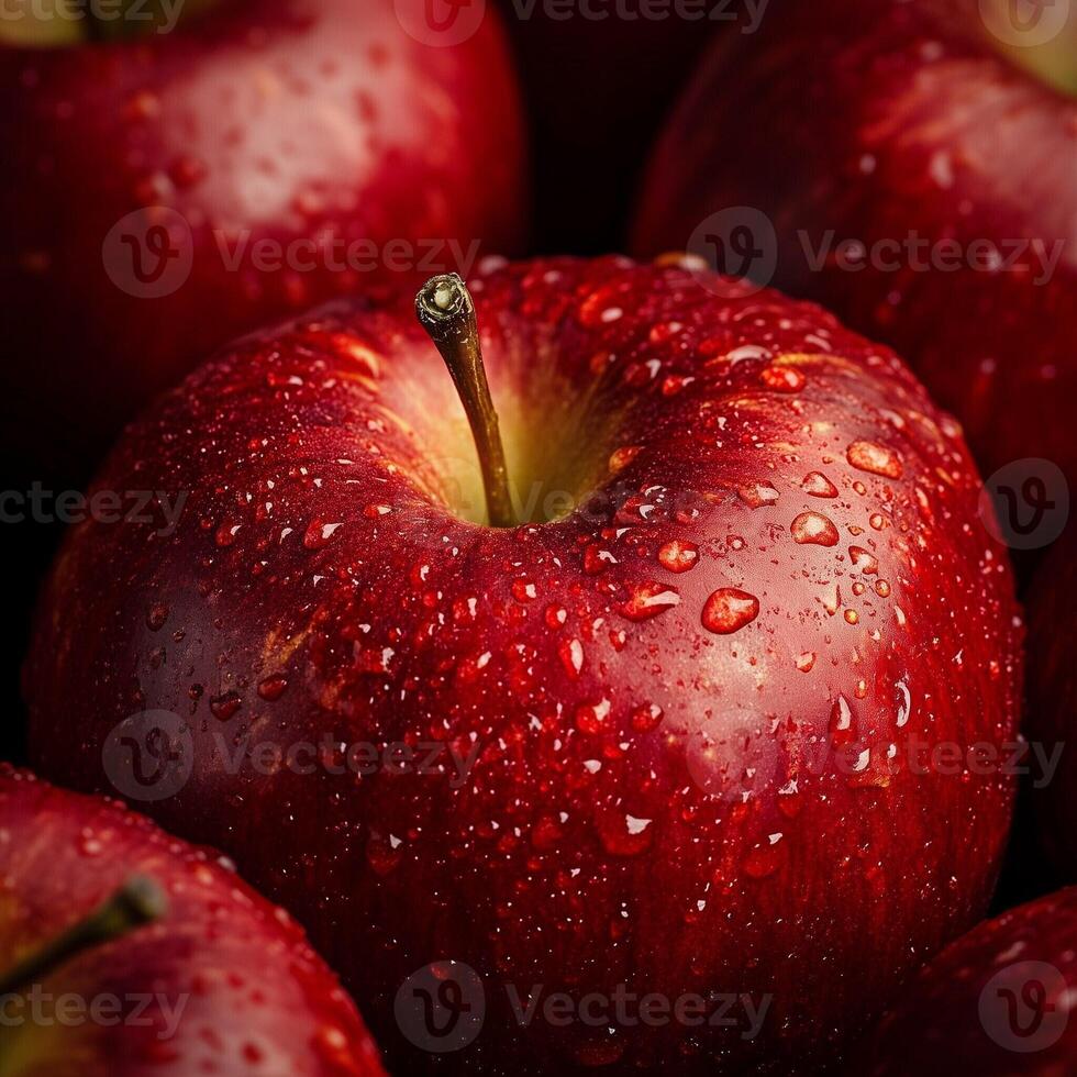 Close-up of a ripe red apple with water droplets creating a fresh and vibrant texture photo