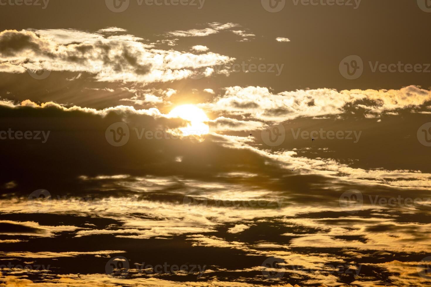 Sunset sky with cloud and sun ray. Natural background. Vintage tone. photo