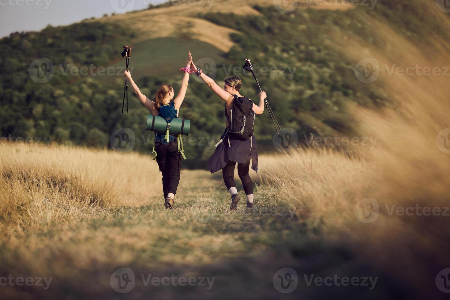 Mother And Daughter Getting On Top Of The Mountain photo