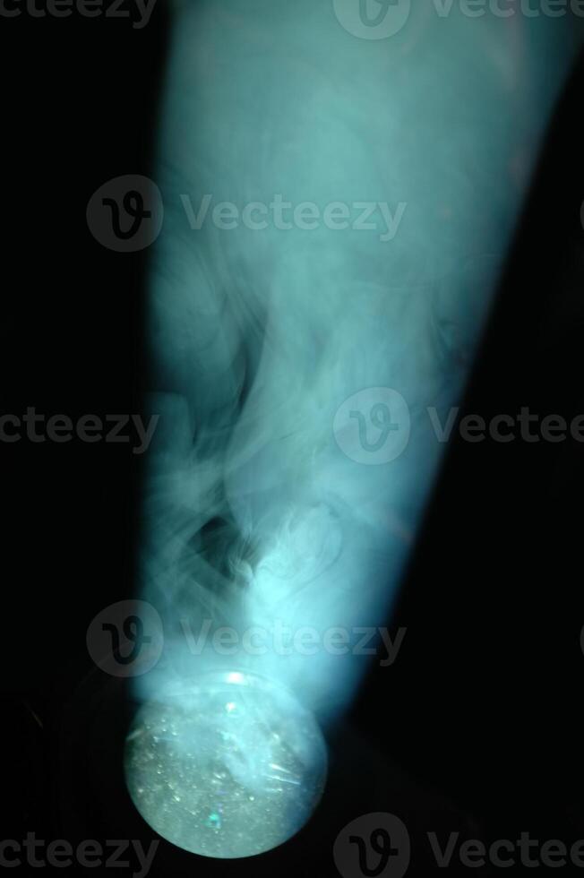 Blue spotlight and smoke photo