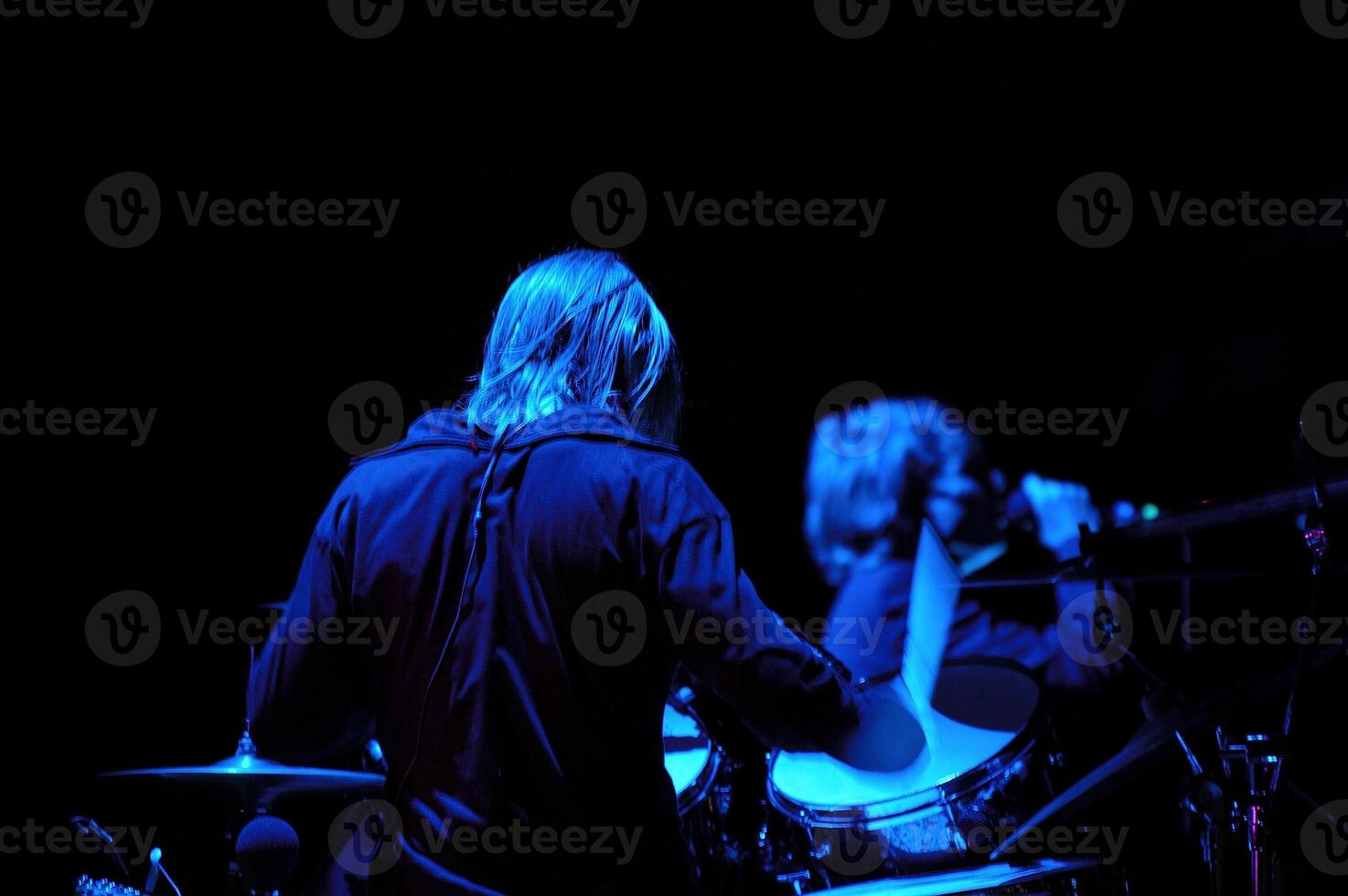 Drummer and blue light photo