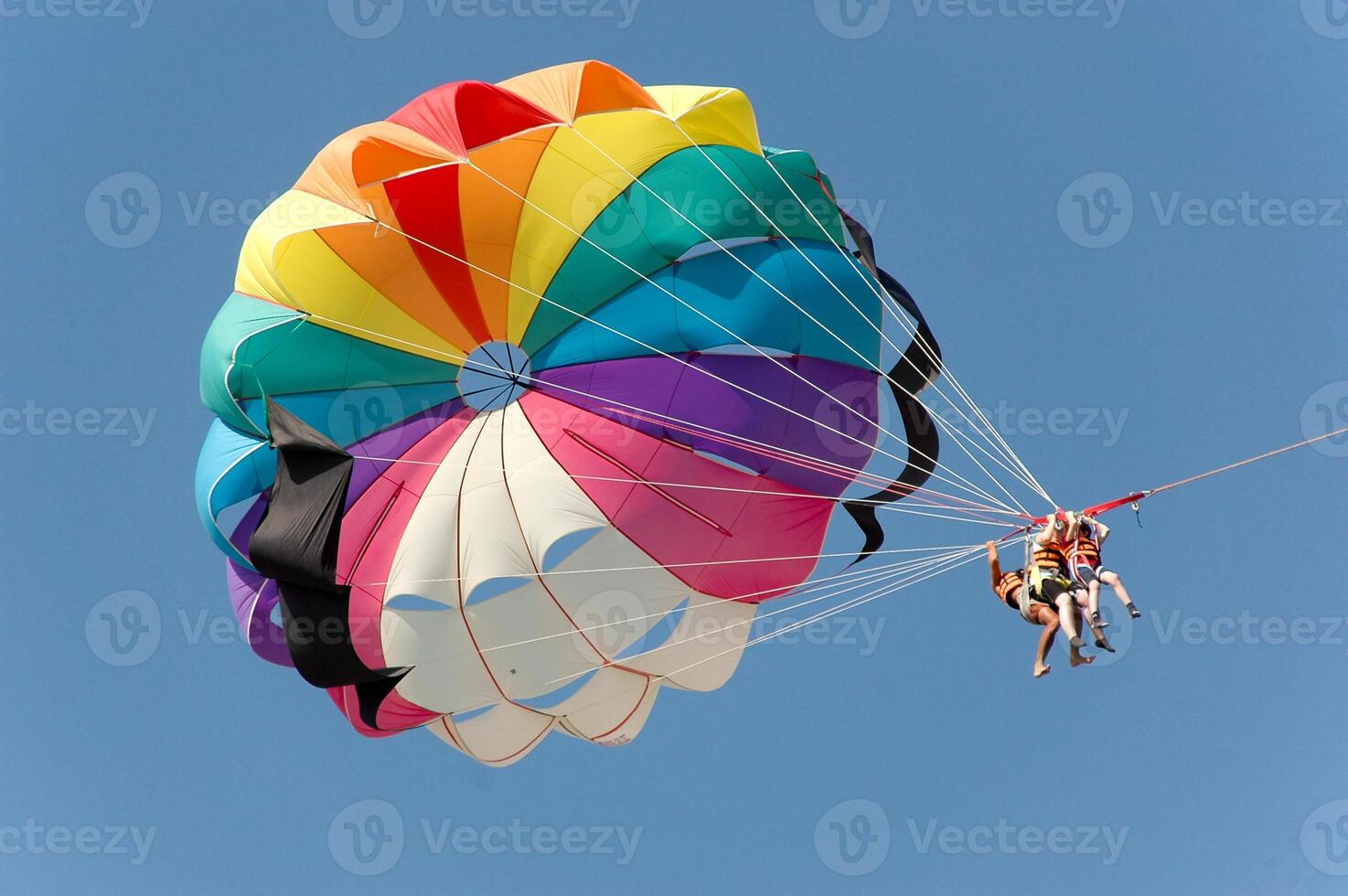 People doing parasailing photo