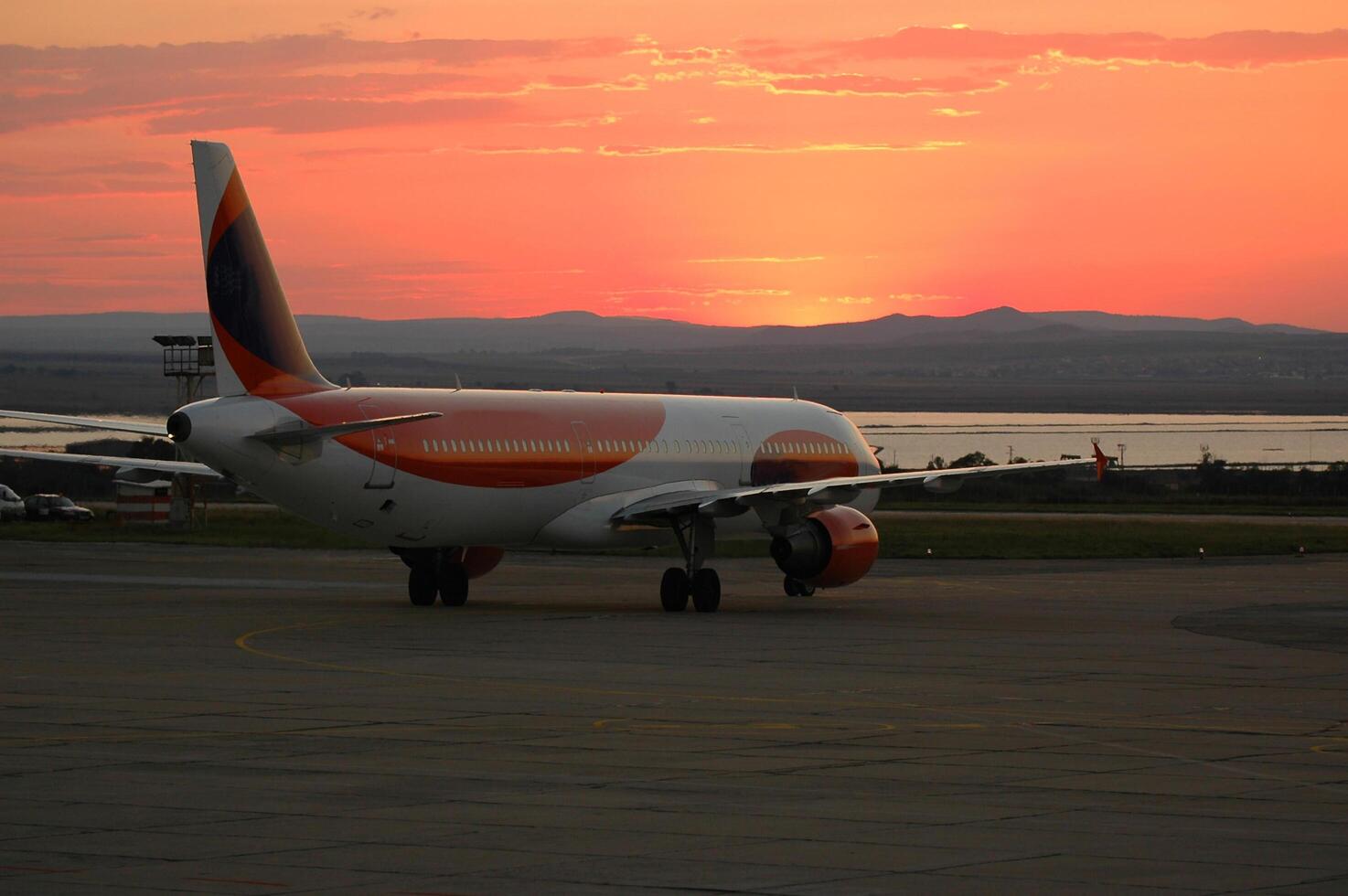Airport, plane and sunset photo