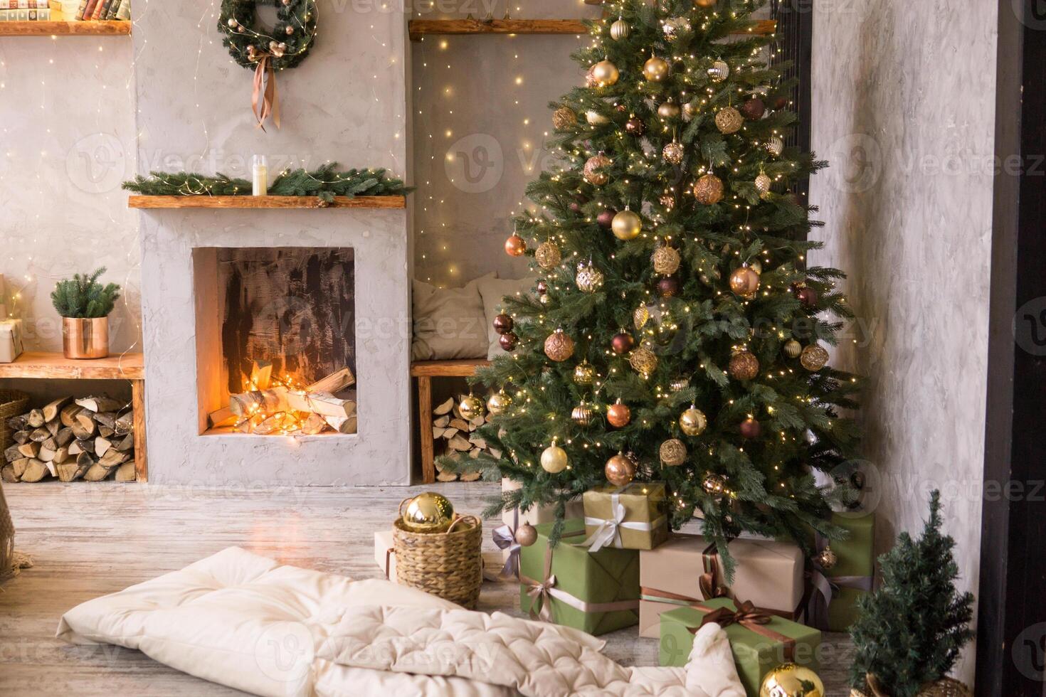 The interior of the Scandinavian-style living room, decorated for the Christmas holidays. Christmas tree next to the fireplace. photo