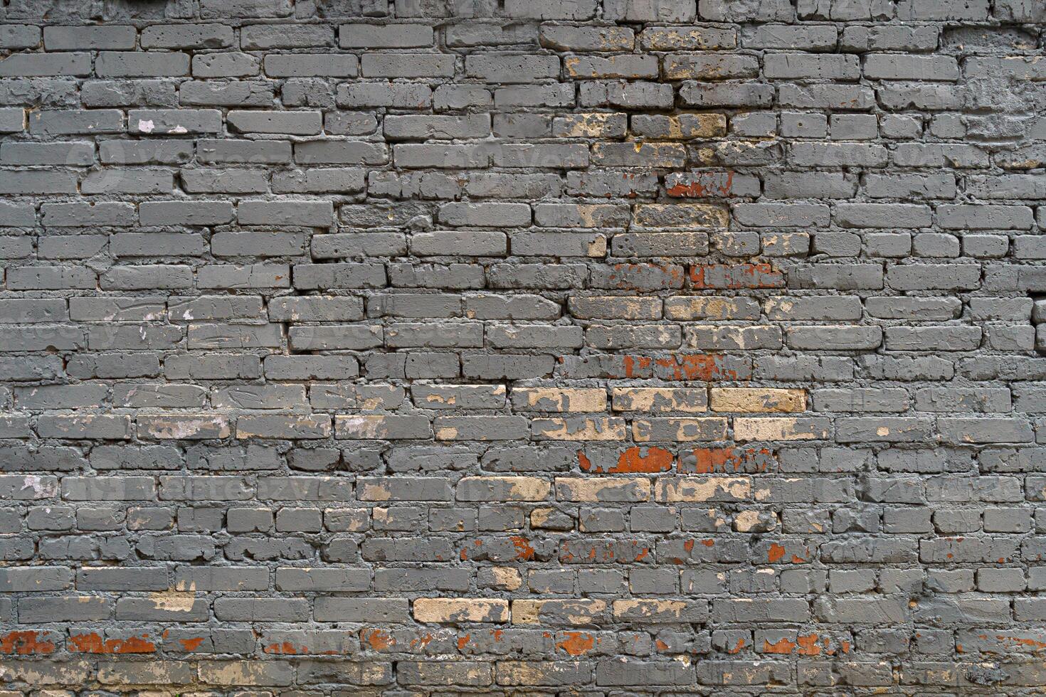 The brick wall is painted with gray paint. Abstract construction background. photo
