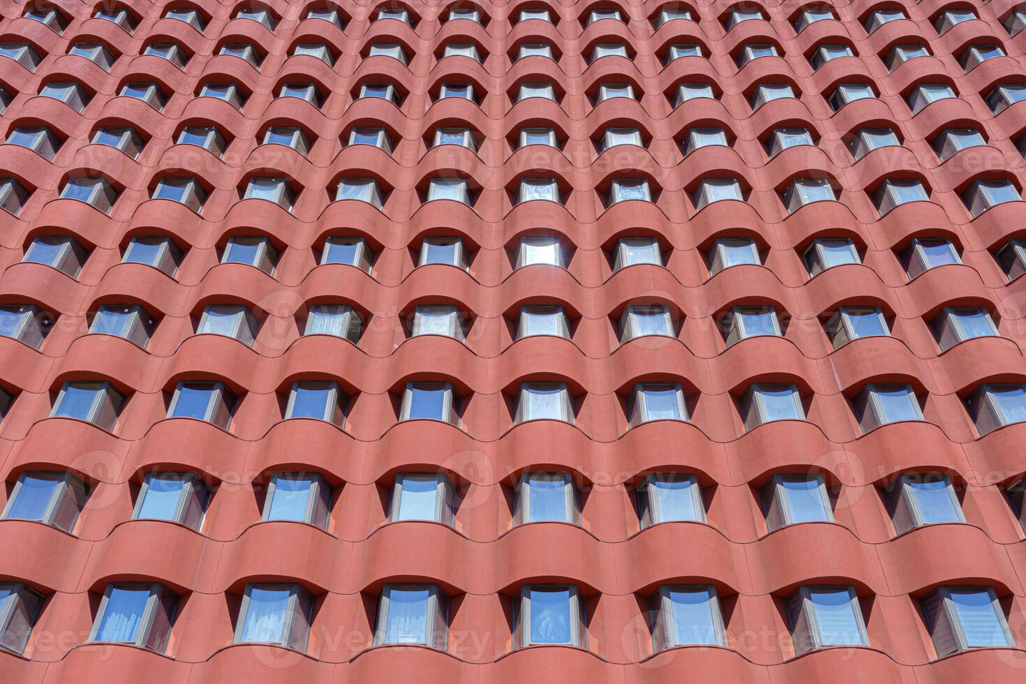 Rows of windows in a modern building. Construction abstract background. photo