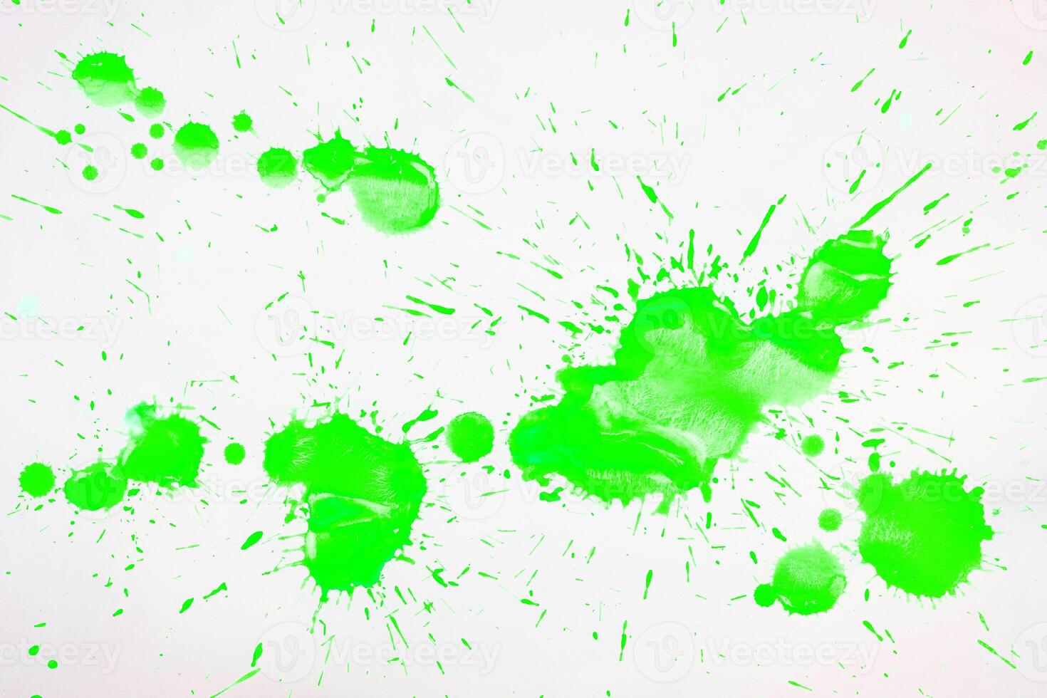 Green blots and spots on a white background. photo