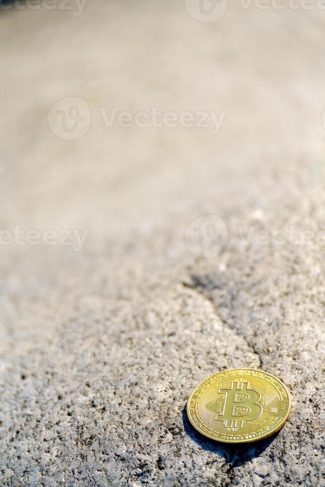 Golden bitcoin coin in natural stones. New financial system. photo