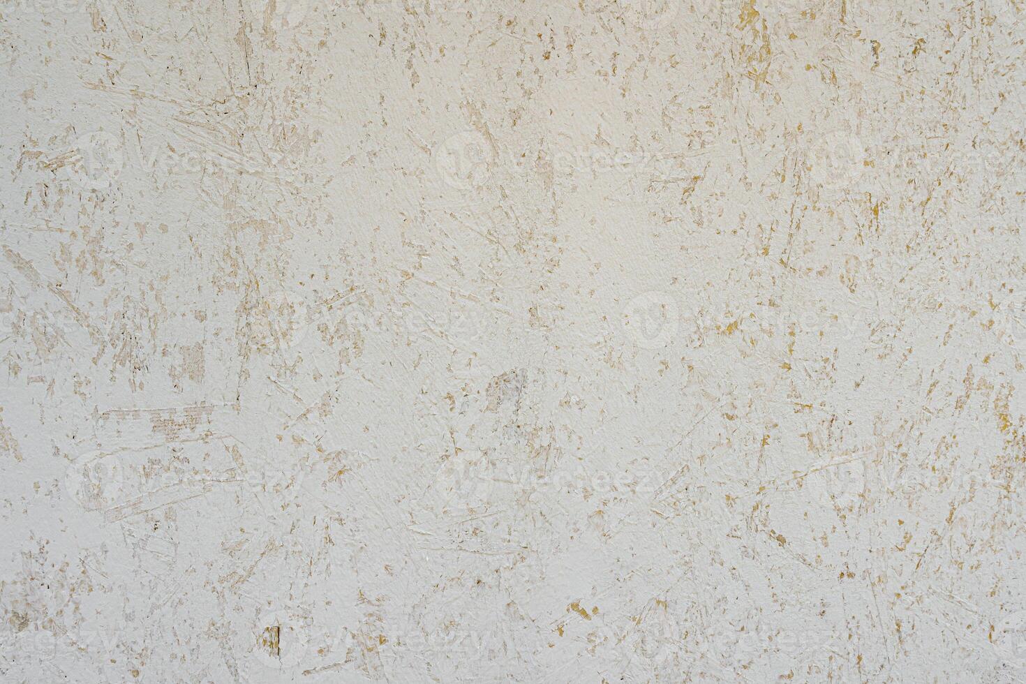 Peeled plaster on the wall. Abstract construction background. photo