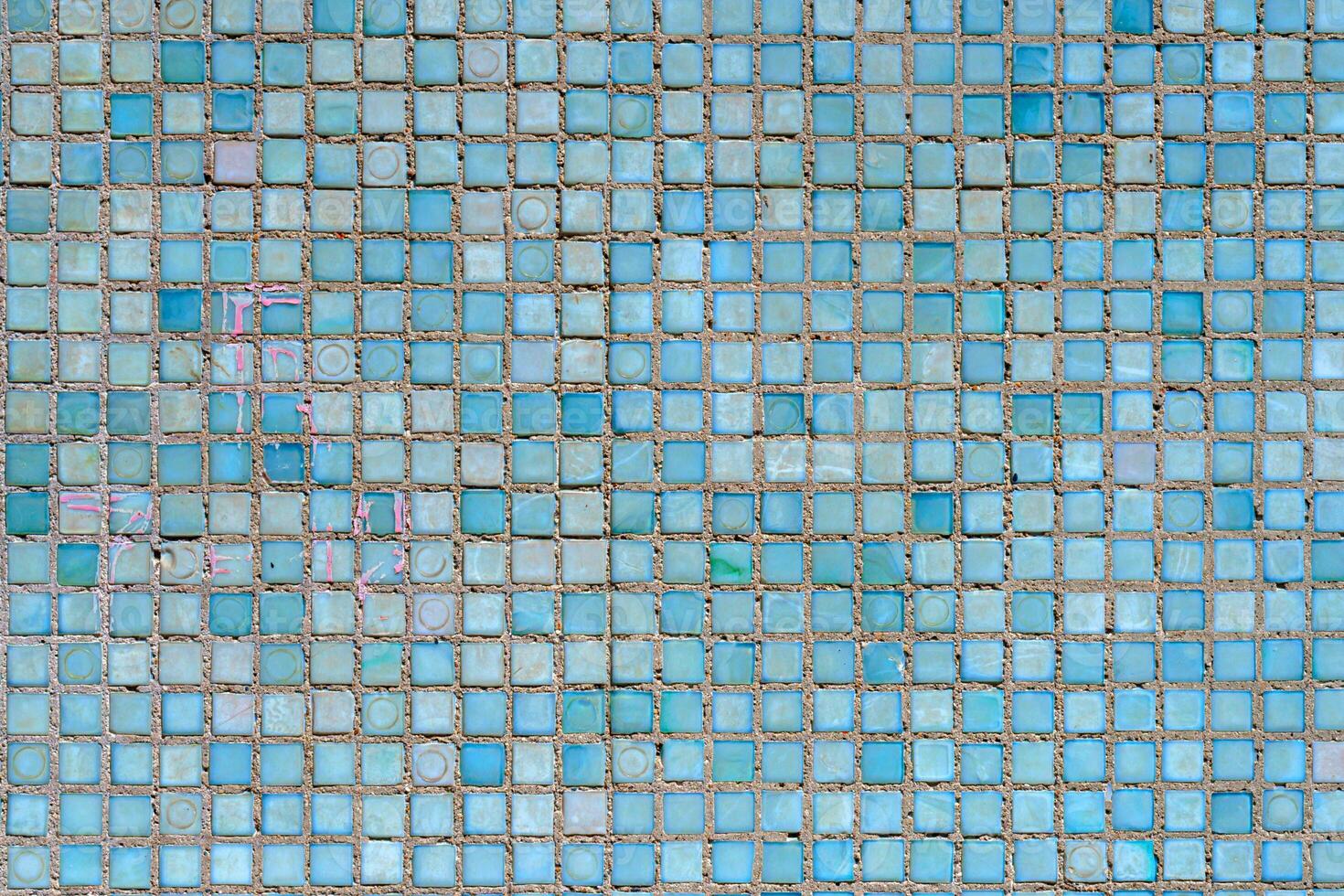 Wall of small blue tiles. Abstract design background. photo