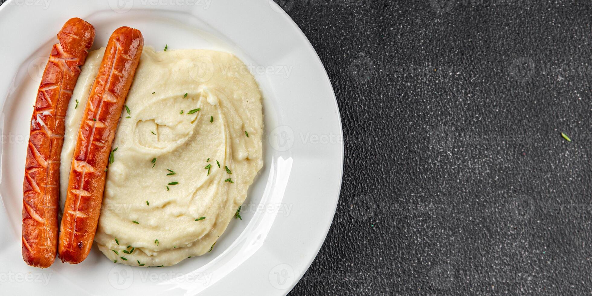 Mashed potatoes and fried sausages food second course dish fresh gourmet food background photo
