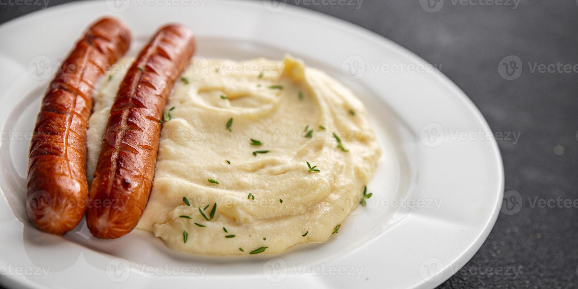 Mashed potatoes and fried sausages food second course dish fresh gourmet food background photo