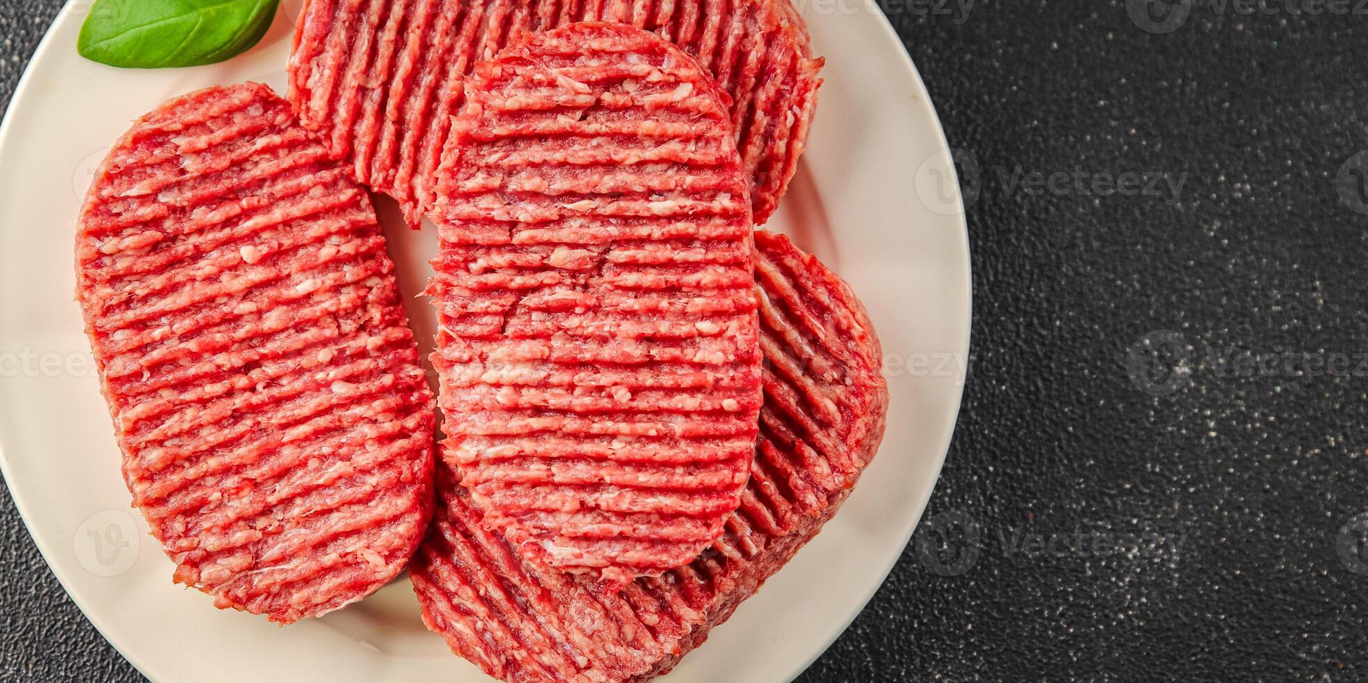Raw cutlet fresh ground meat beef burger, pork, chicken, turkey second course dish fresh delicious gourmet food background on the table rustic food top view copy space photo
