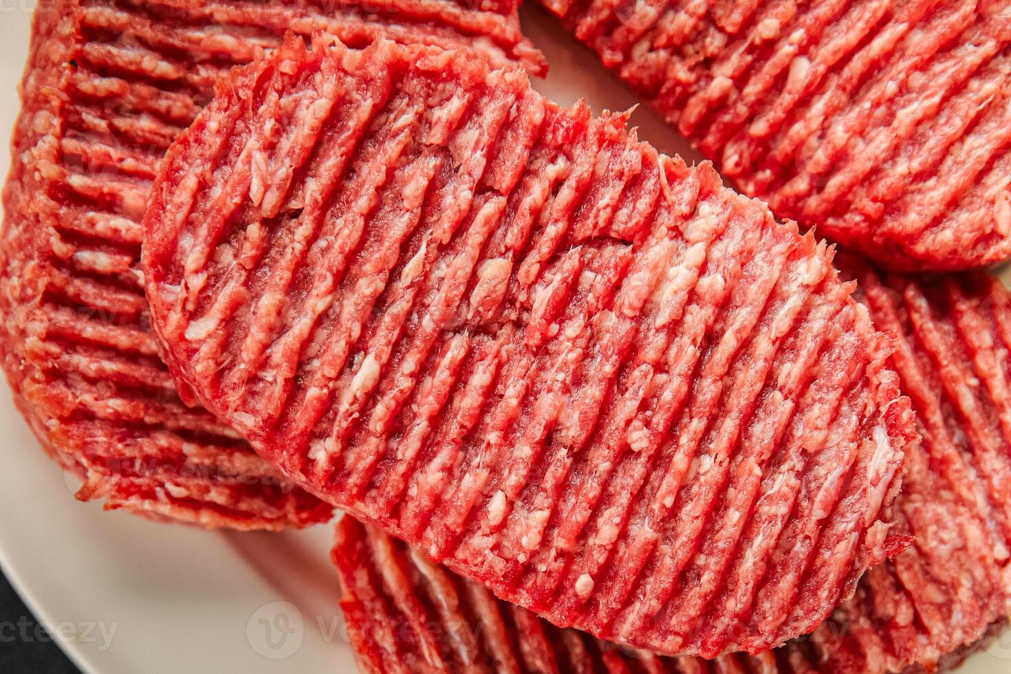 Raw cutlet fresh ground meat beef burger, pork, chicken, turkey second course dish fresh delicious gourmet food background on the table rustic food top view copy space photo