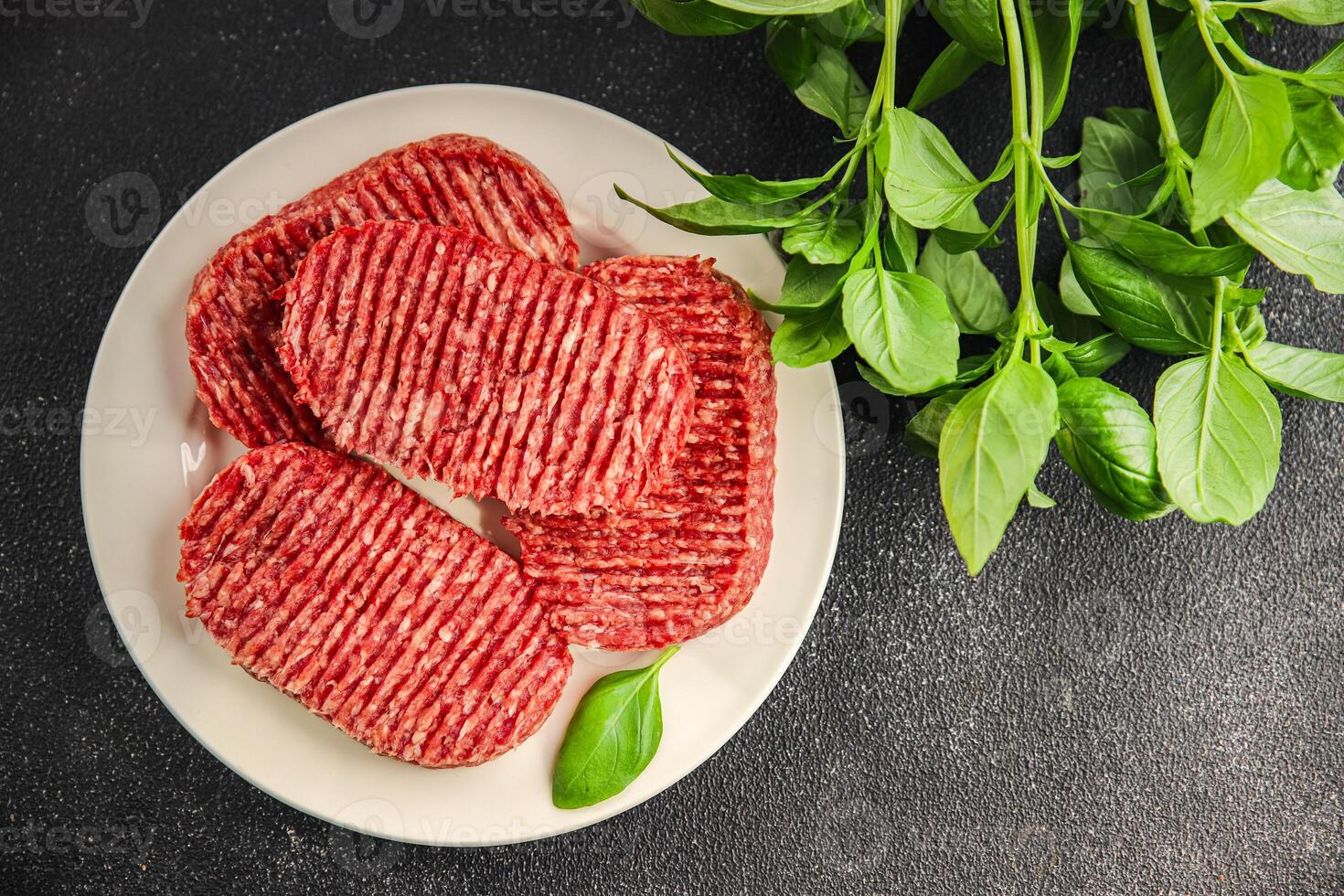 Raw cutlet fresh ground meat beef burger, pork, chicken, turkey second course dish fresh delicious gourmet food background on the table rustic food top view copy space photo