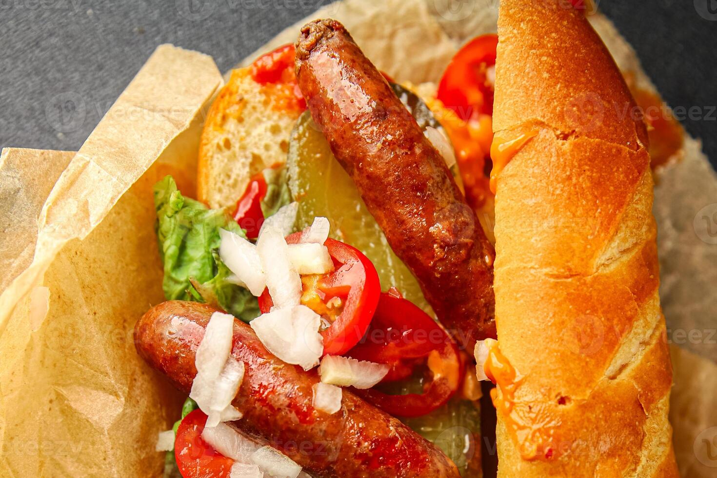 hot dog sausages, bun, greens, sauce fast food delicious food dish Fresh delicious gourmet food background on the table rustic food top view copy space photo