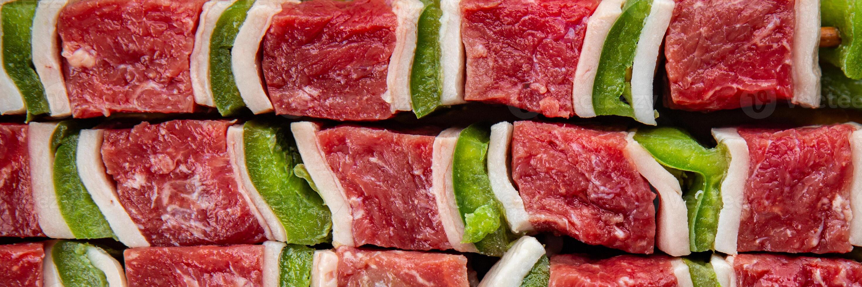 kebab raw meat fresh vegetables pork, lard, pepper, vegetable dish gourmet food background on the table rustic food top view copy space photo