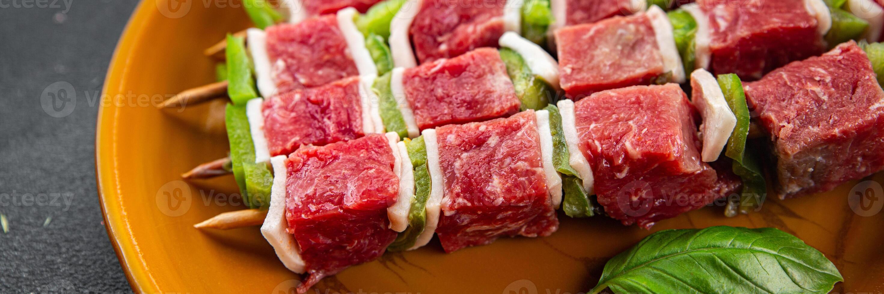 kebab raw meat fresh vegetables pork, lard, pepper, vegetable dish gourmet food background on the table rustic food top view copy space photo