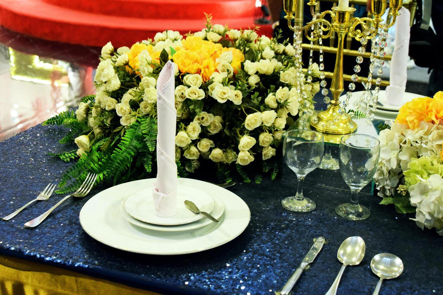 A luxurious plate and accessories are on a dining table photo