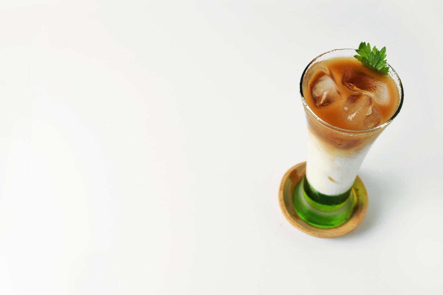 Top view of pandan milk iced coffee looks very fresh a white background photo
