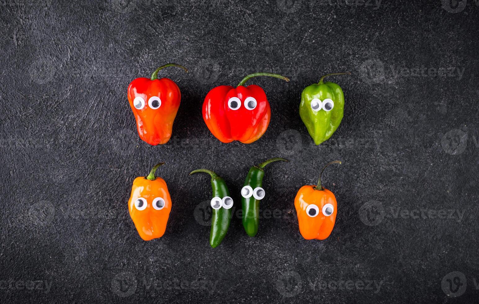 Cute color bell pepper with eyes. photo