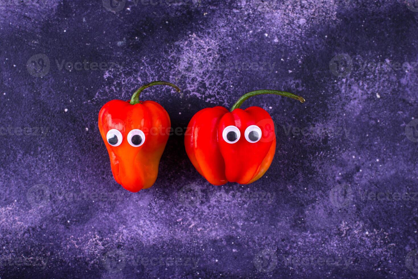 Cute color bell pepper with eyes. photo