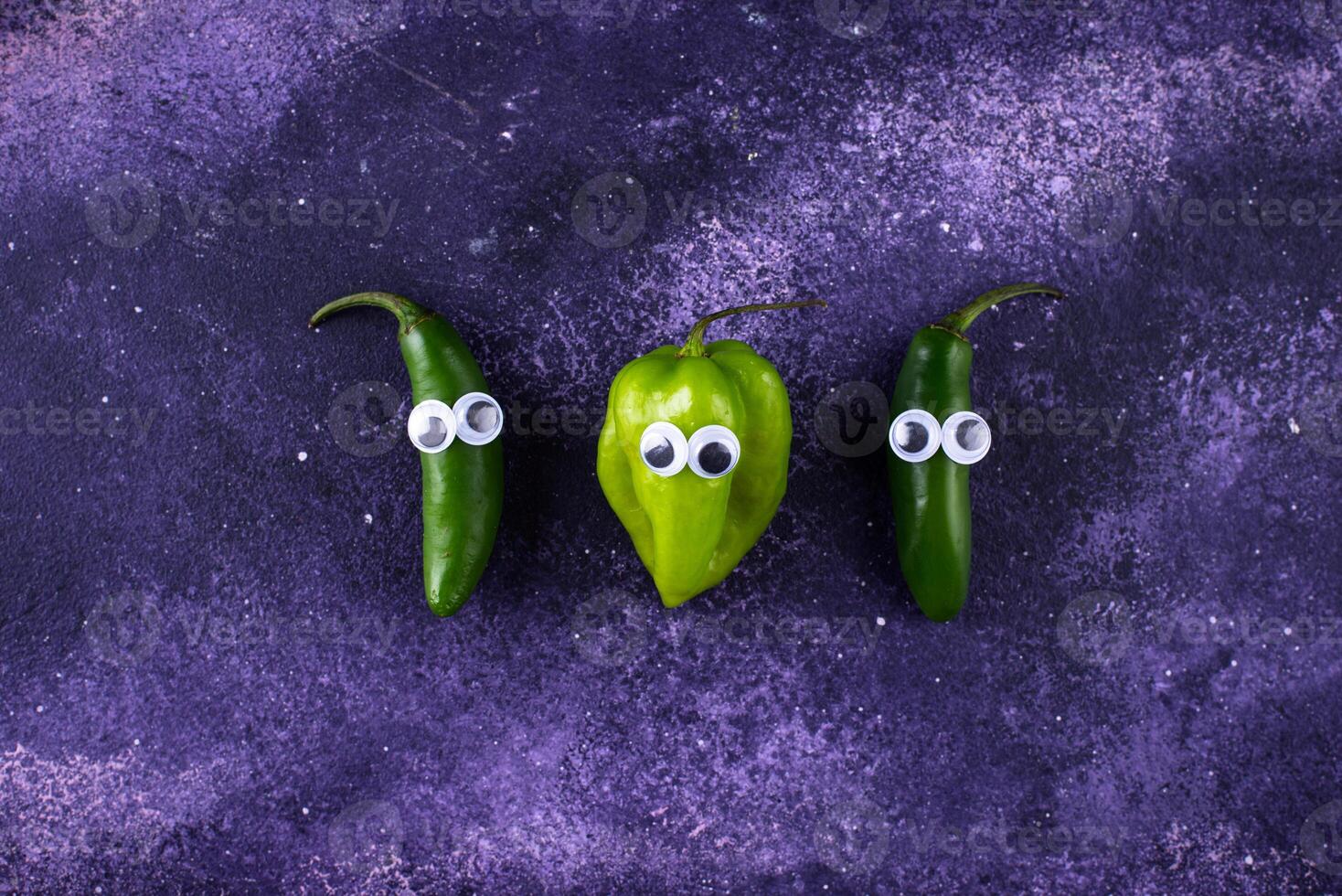 Cute color bell pepper with eyes. photo